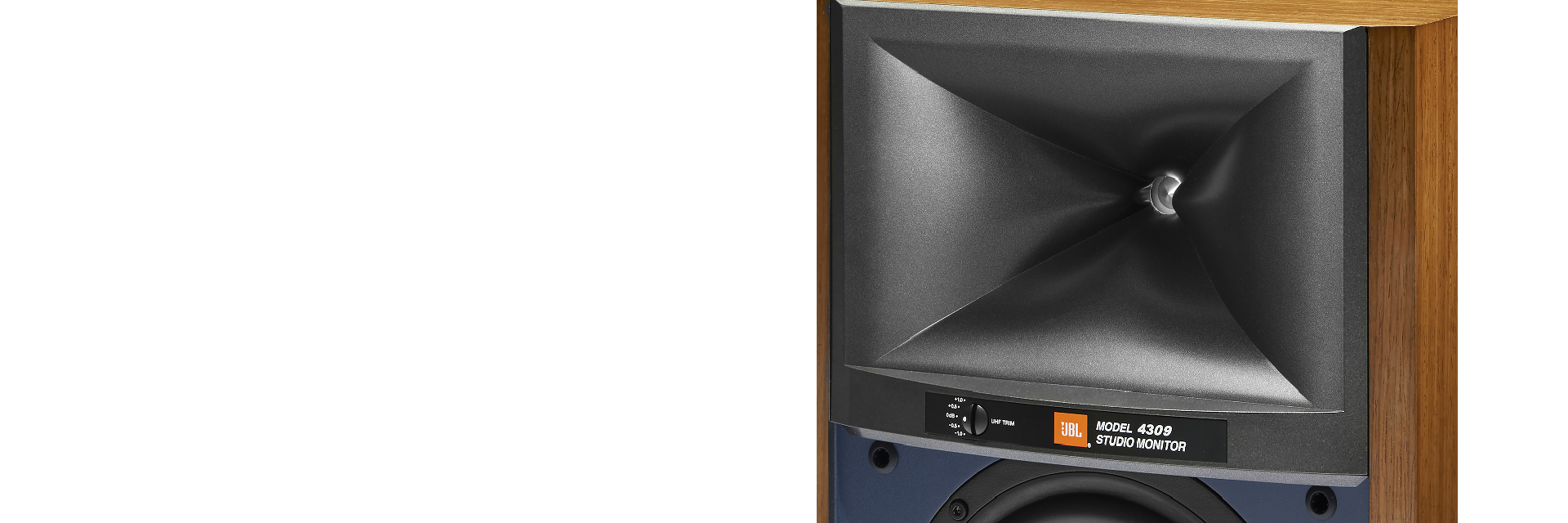 6.5-inch (165mm) pure-pulp cone woofer in bass-reflex design with dual front-firing tuned ports.